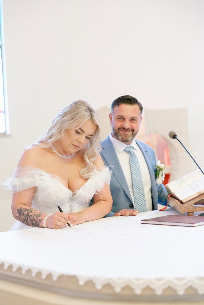 signing documents Wedding in church in Poland
